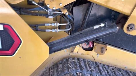 cat skid steer hydraulic oil drain|cat 259d hydraulic drain.